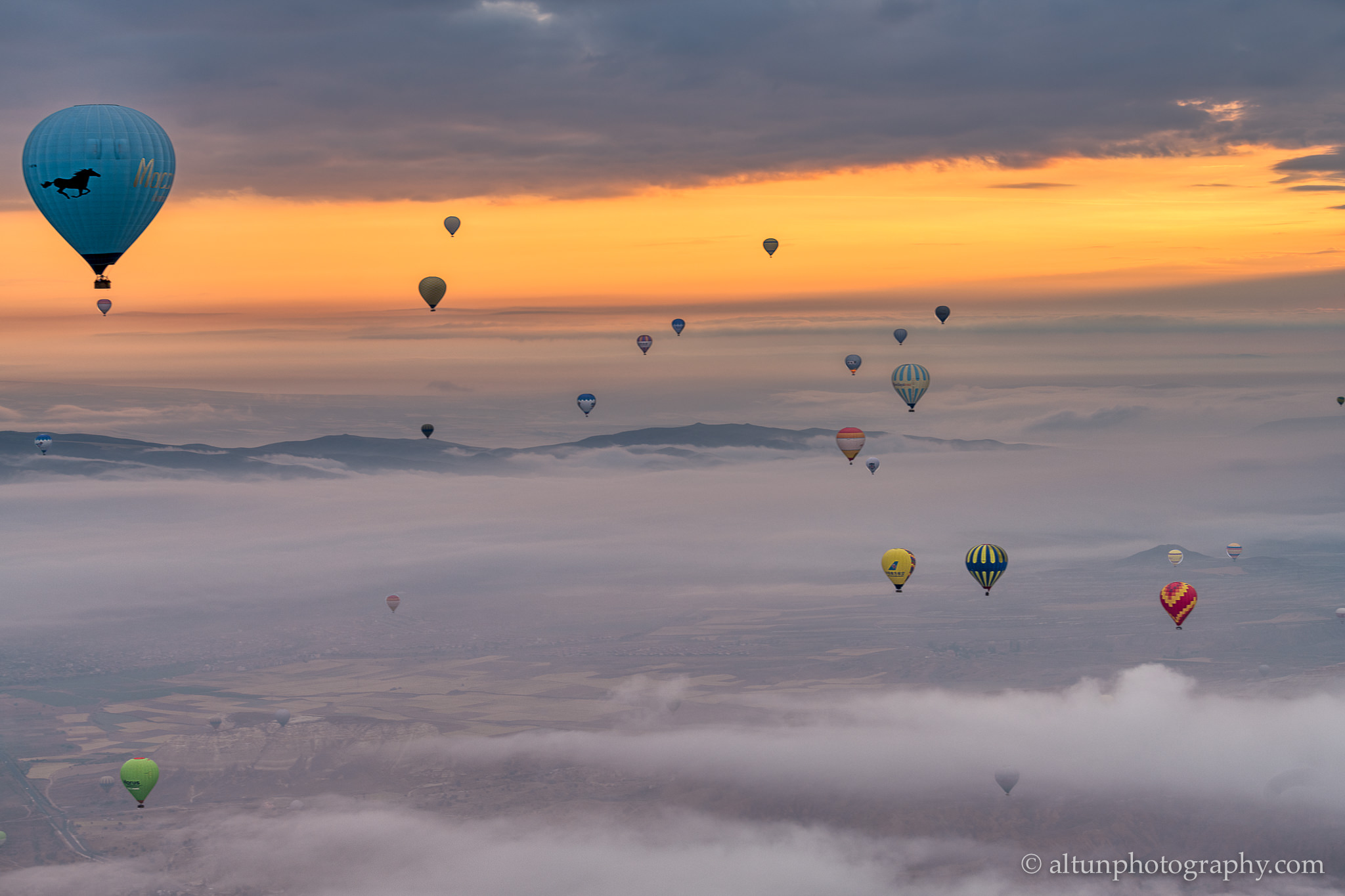 Balloons over clouds in Cappadocia